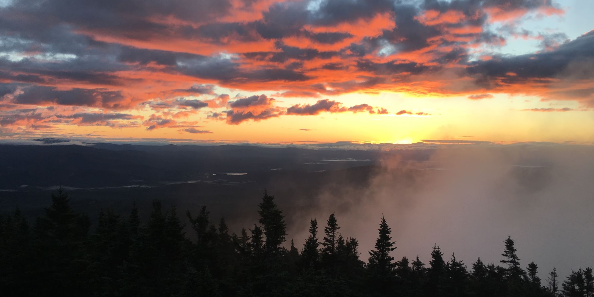 hero banner Sunset on a mountian top enjoying freeze dried snacks